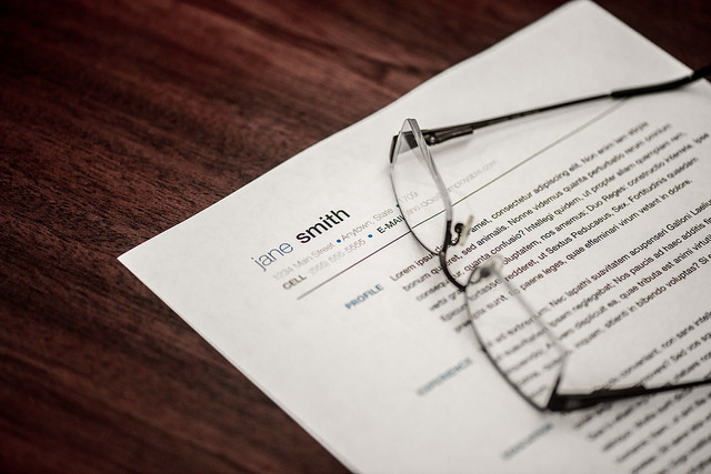 resume on table with eyeglasses